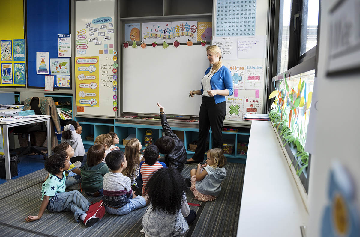 kindergarten-students-sitting-on-the-floor-listeni-2021-08-27-00-01-58-utc.jpg